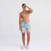 Front - Model wearing Oh Buoy 2N1 Swim Trunk 7" in Big Bloom- Washed Blue