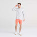 Front - Model wearing Oh Buoy 2N1 Swim Trunk 7" in Cantelope