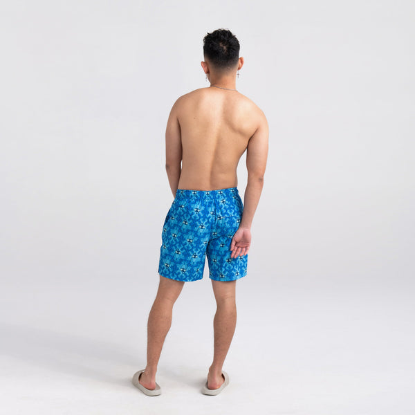 Back - Model wearing Oh Buoy 2N1 Swim Short Regular in Krakken Toile- Blue
