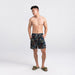 Front - Model wearing Oh Buoy 2N1 Swim Short Regular in Painterly Paradise- Multi