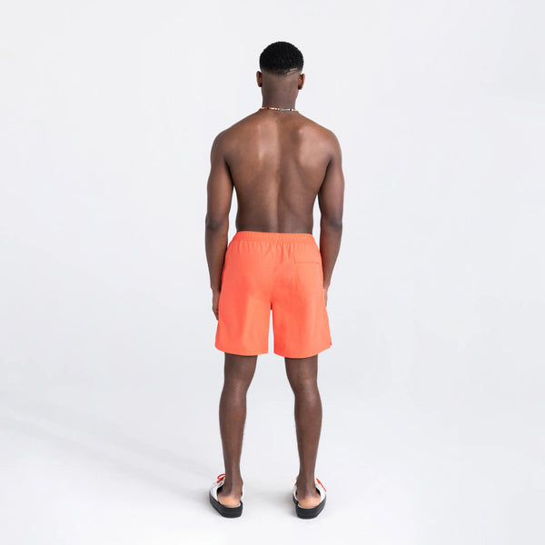 Back - Model wearing Go Coastal 2N1 Swim Volley Short 7" in Hot Coral