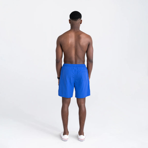 Back - Model wearing Go Coastal 2N1 Swim Volley Short 7" in Sport Blue