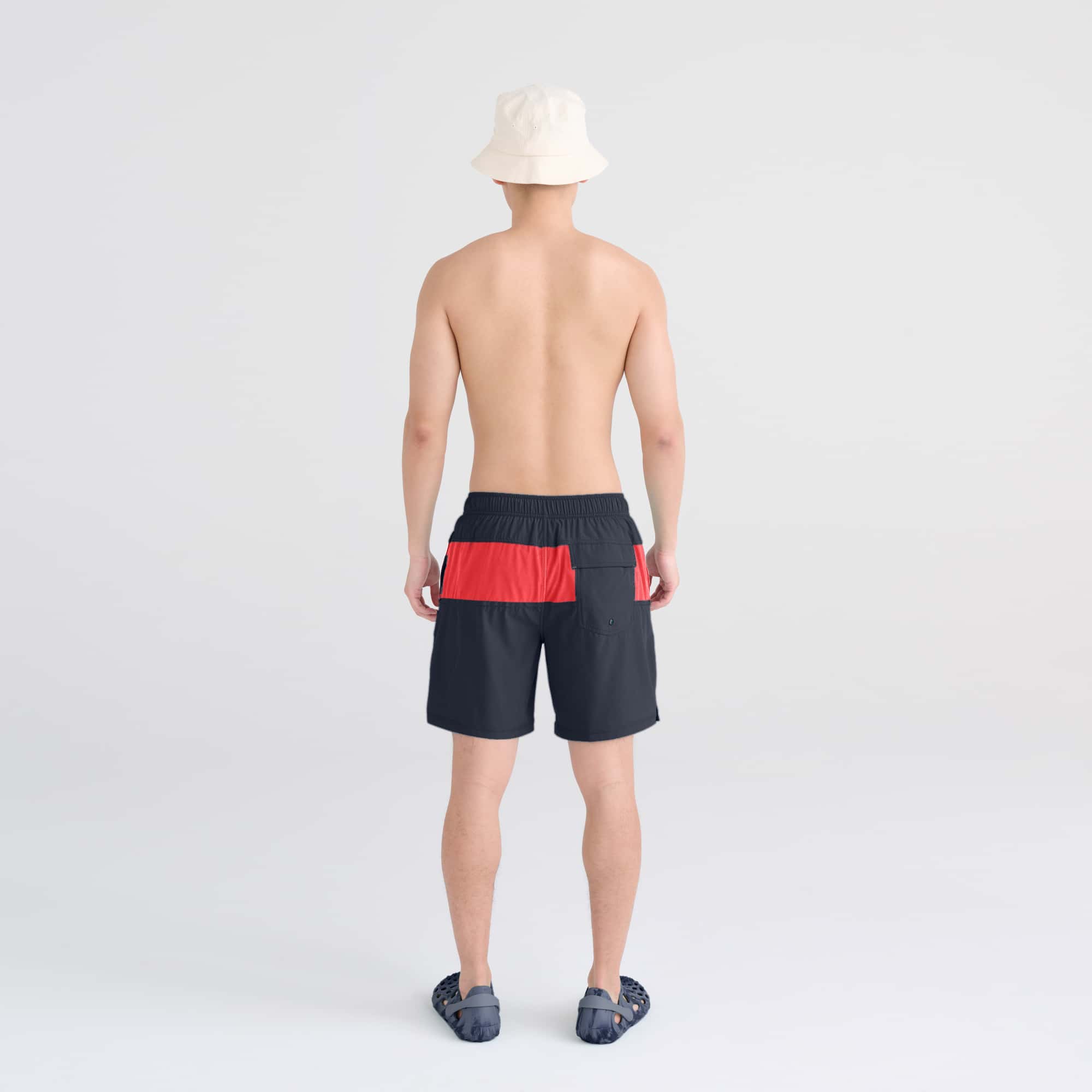 Back - Model wearing Oh Buoy 2N1 Swim Trunk 7" in India Ink/Hibiscus