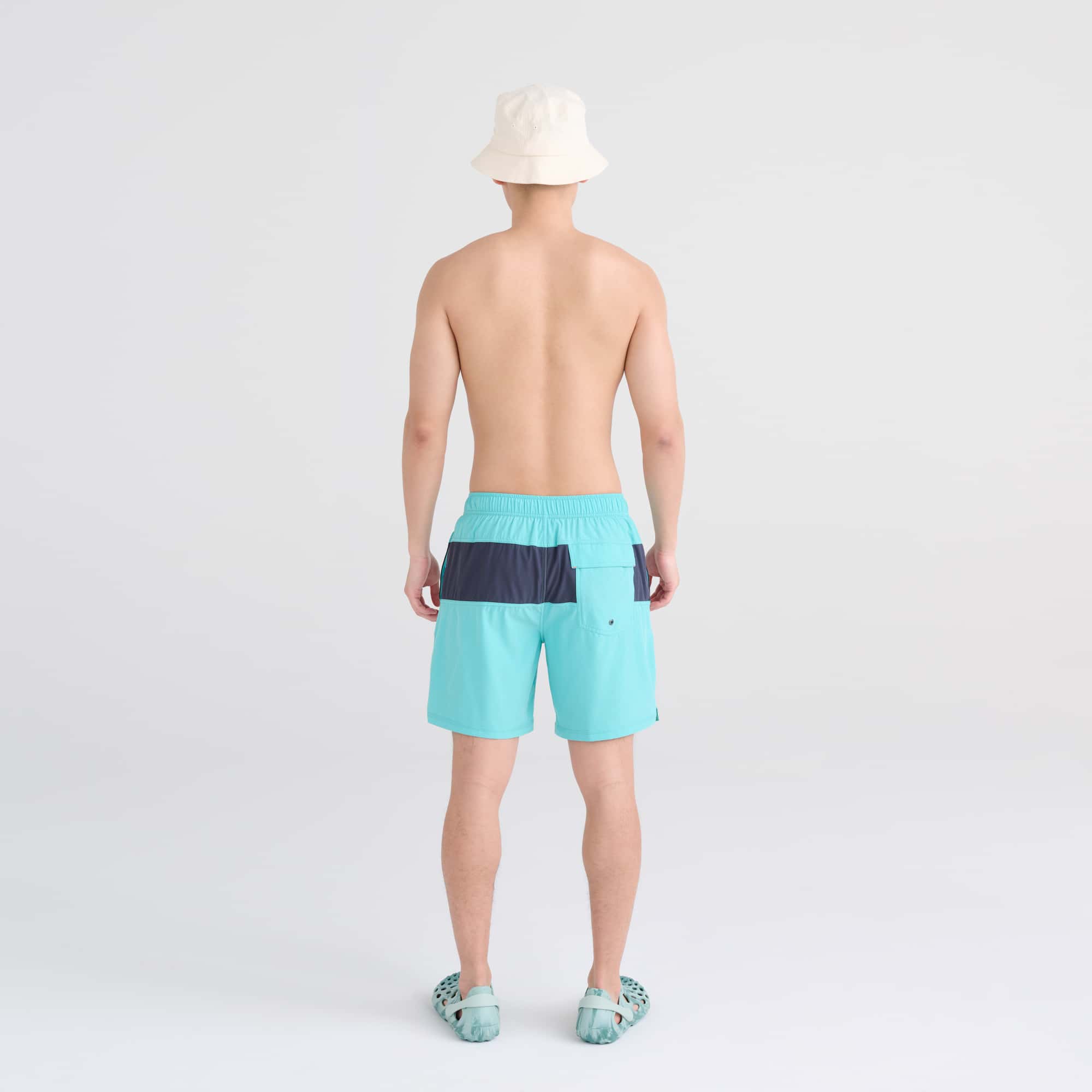 Back - Model wearing Oh Buoy 2N1 Swim Trunk 7" in Turquiose/India Ink