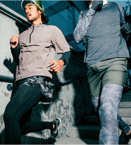 Two men running down stairs in performance apparel